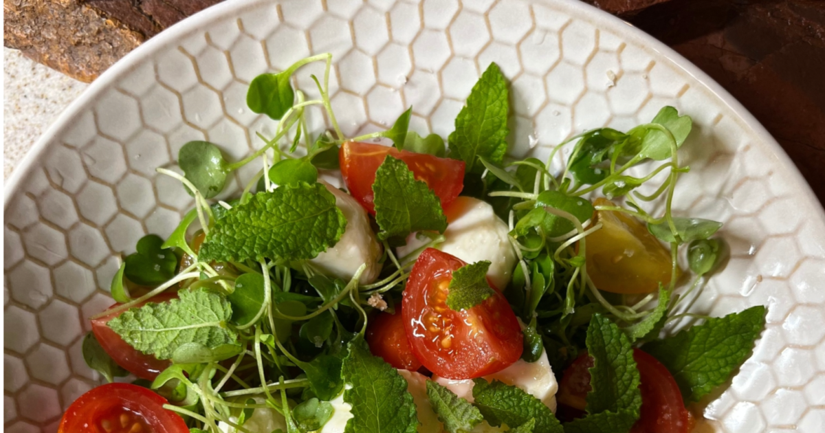 Fresh Mozzarella & Sugared Cherry Tomatoes with Arugula Sprouts, Strawberry Mint, Lemon Olive Oil & Citrus Salt